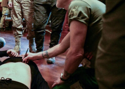 Teaching clinical skills to some soldiers and PFVMH volunteers.